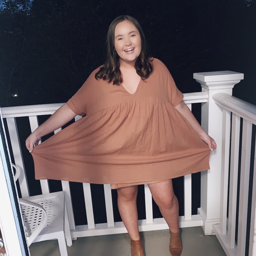 A burnt orange baby doll dress